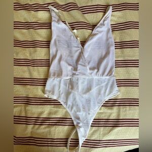 Elegant White Plunge Bodysuit